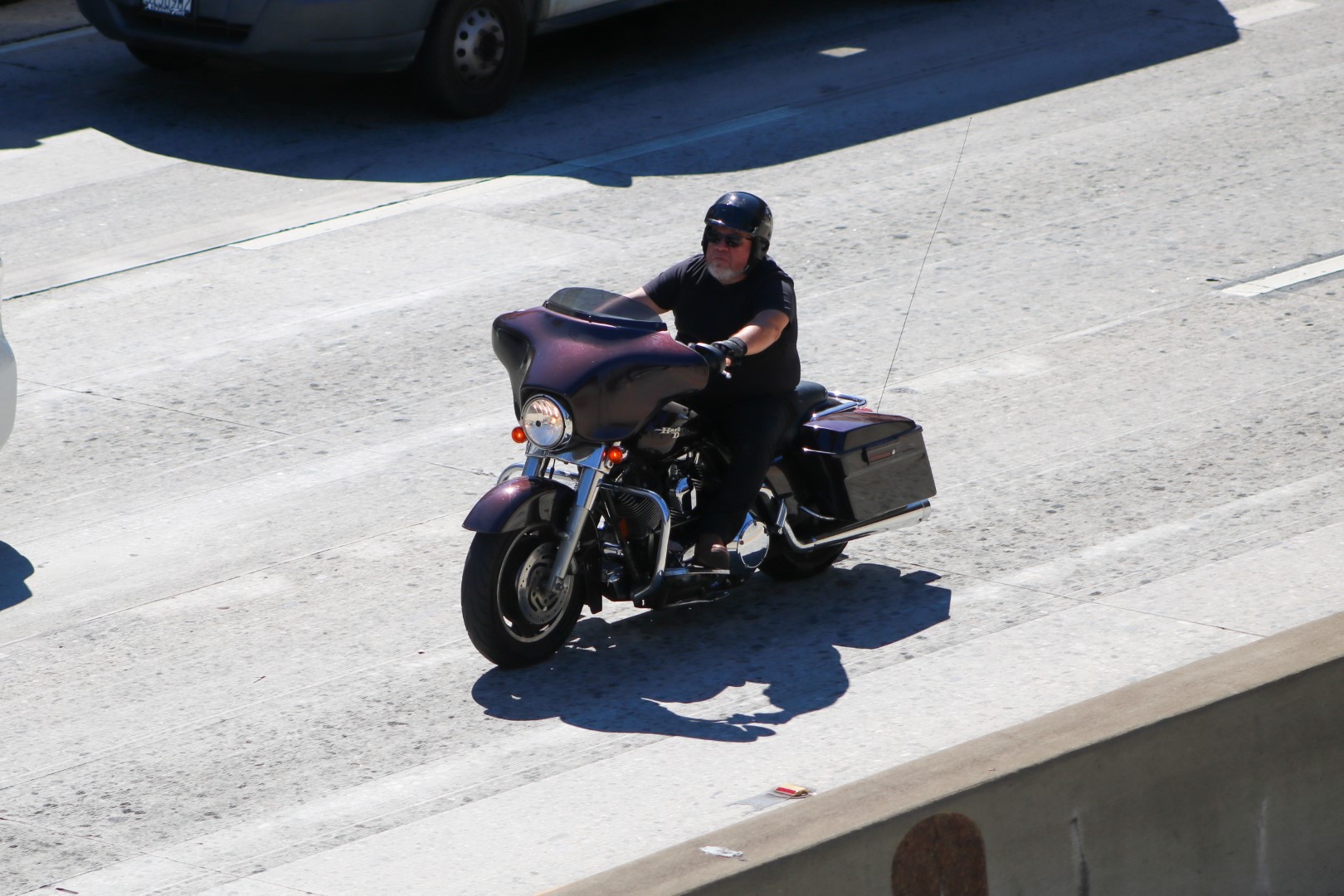 Motorcyclist with helmet on traveling on L.A. Freeway