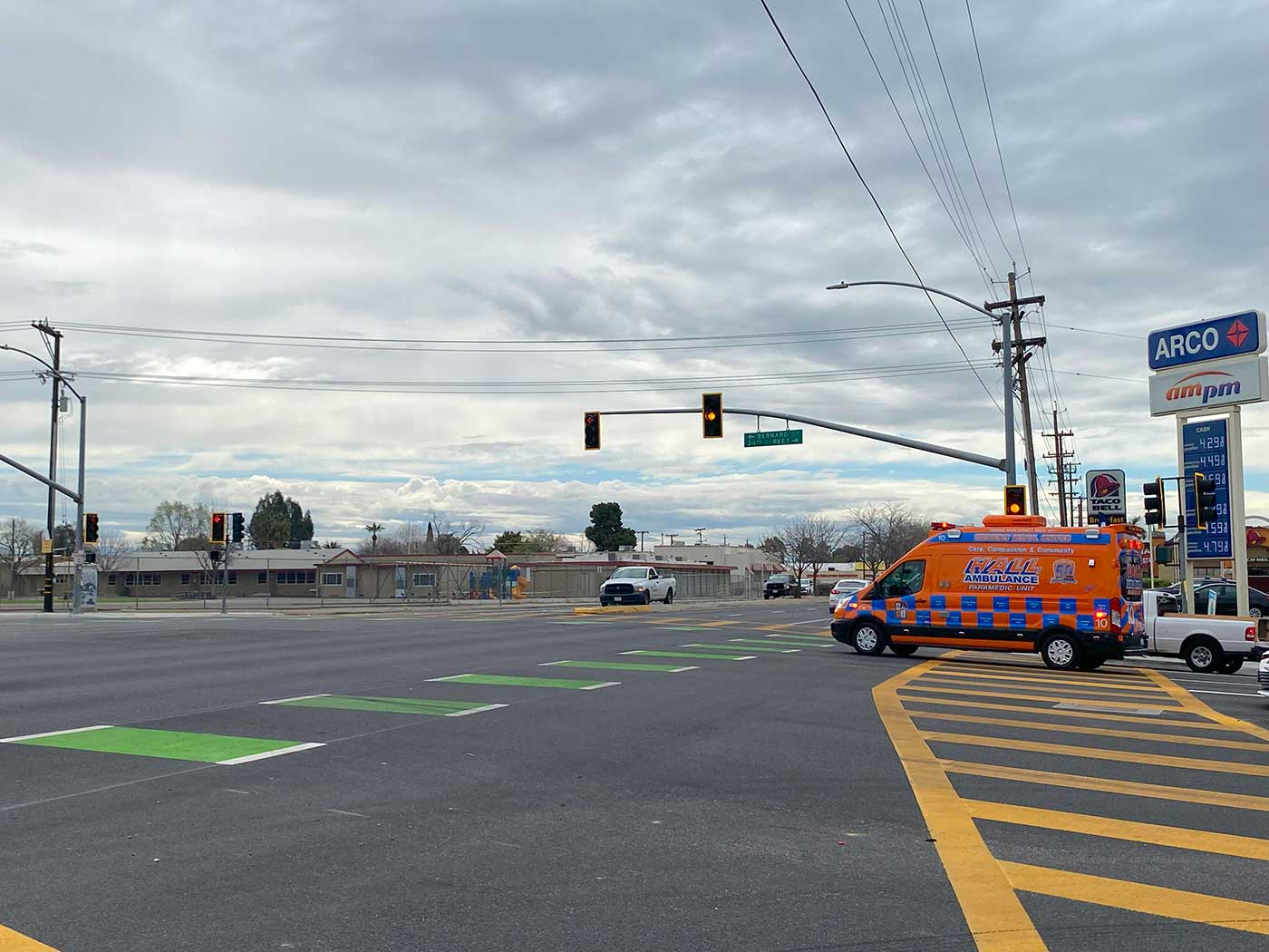 Traffic going through a pedestrian crosswalk on Bernard St in Bakersfield, CA