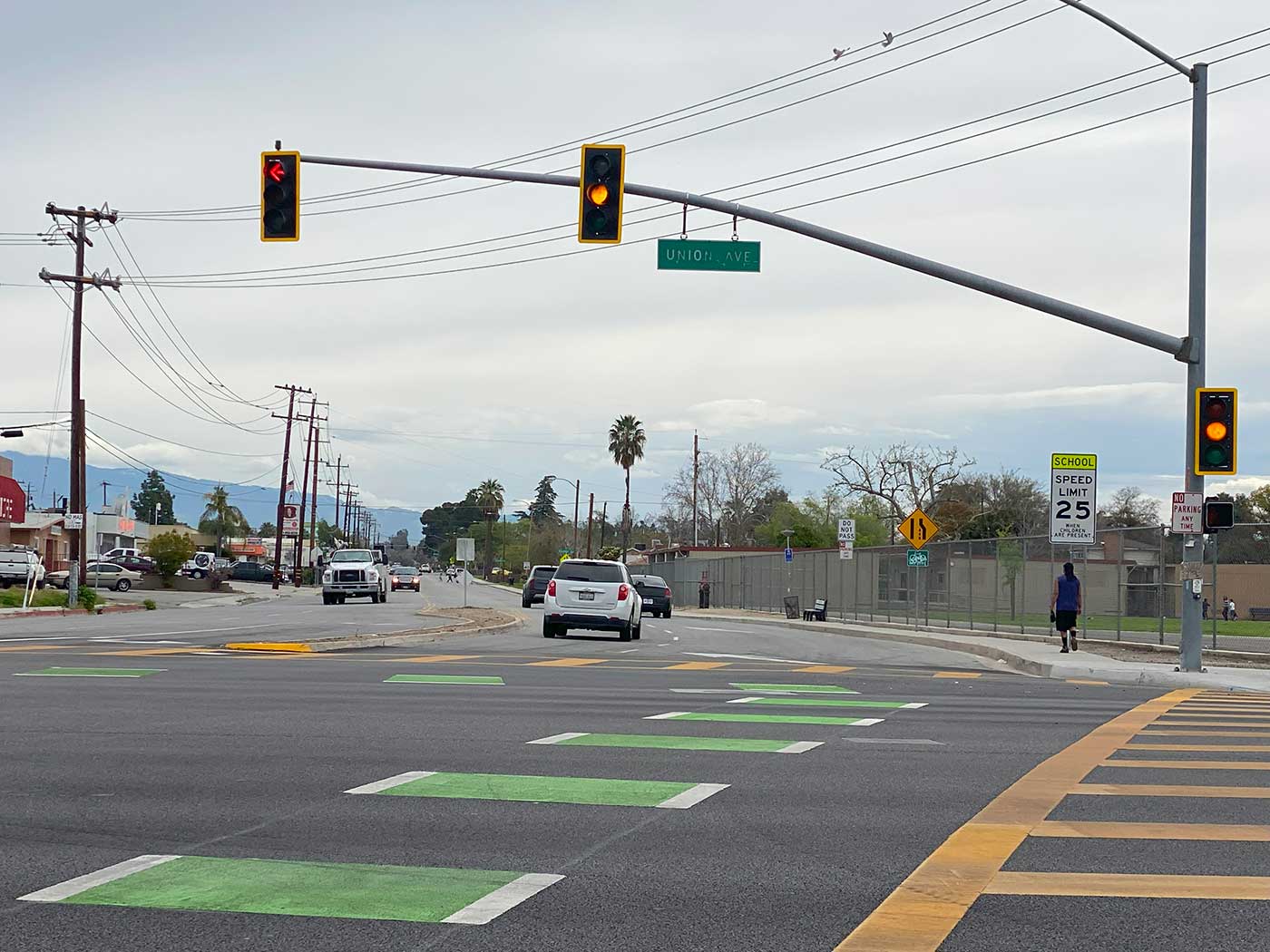 Pedestrian after crossing a pedestrian crosswalk on Union Ave in Bakersfield, CA