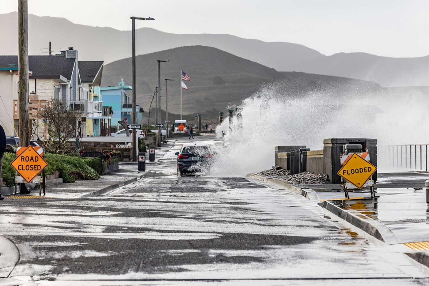 Car traveling through flood waters in Northern California.