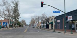 Traffic crossing through a K Street intersection in Tulare, CA