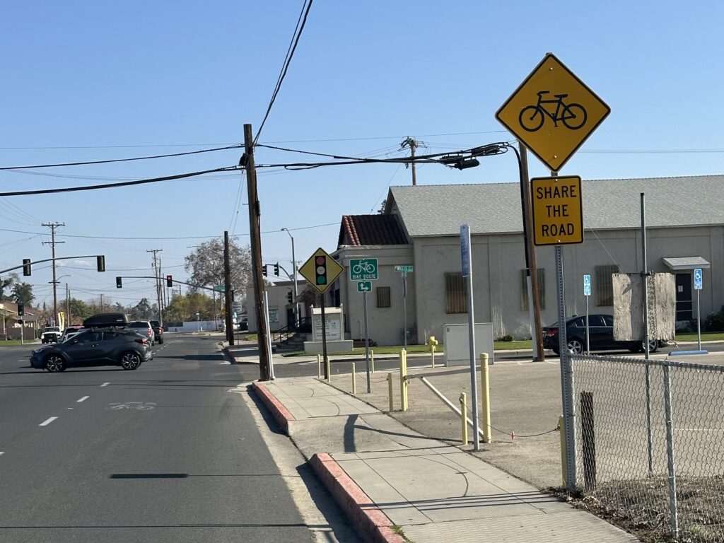A “Share the Road” bicycle sign along Houston Avenue in Visalia.