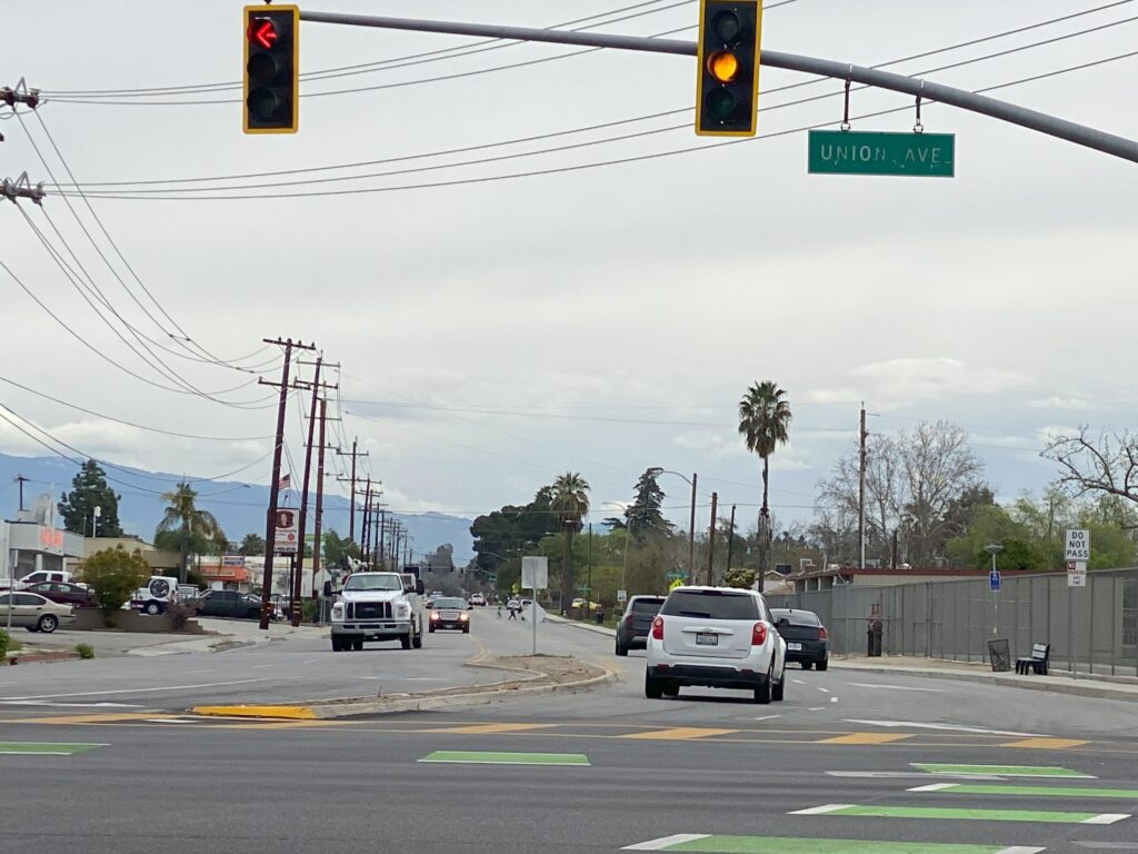 Large utility truck taking up more than one lane on Bernard Street near Union Avenue intersection.