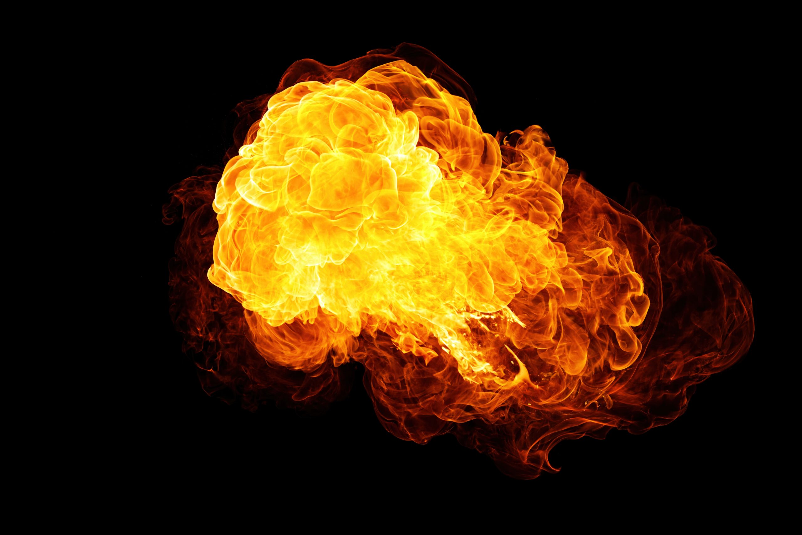A ball of flames emerging from the darkness
