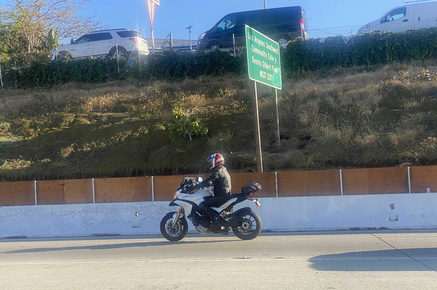 A motorcyclist along The 105 in southern Los Angeles.